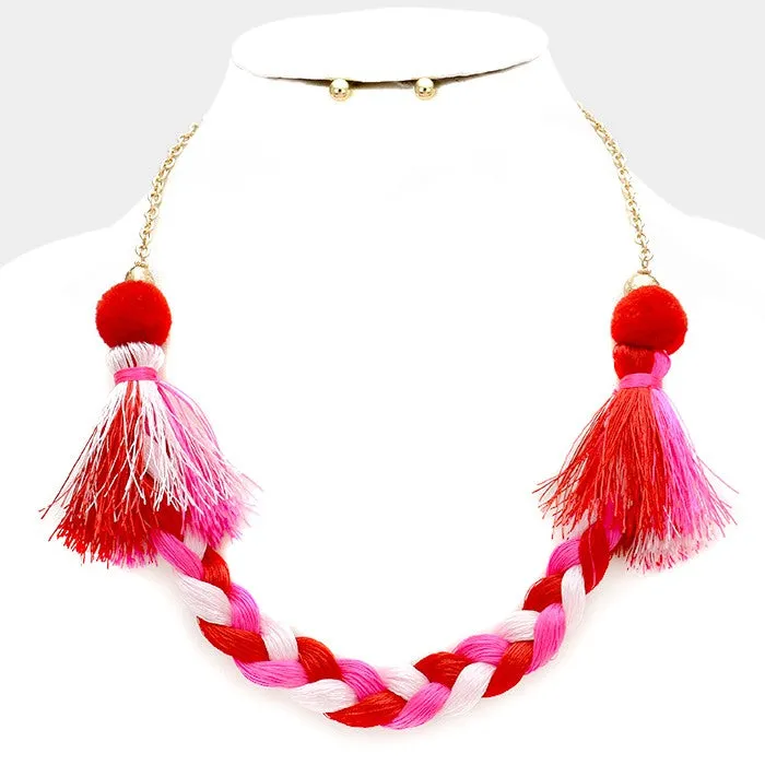 iLLASPARKZ Braided thread necklace with pom pom tassels